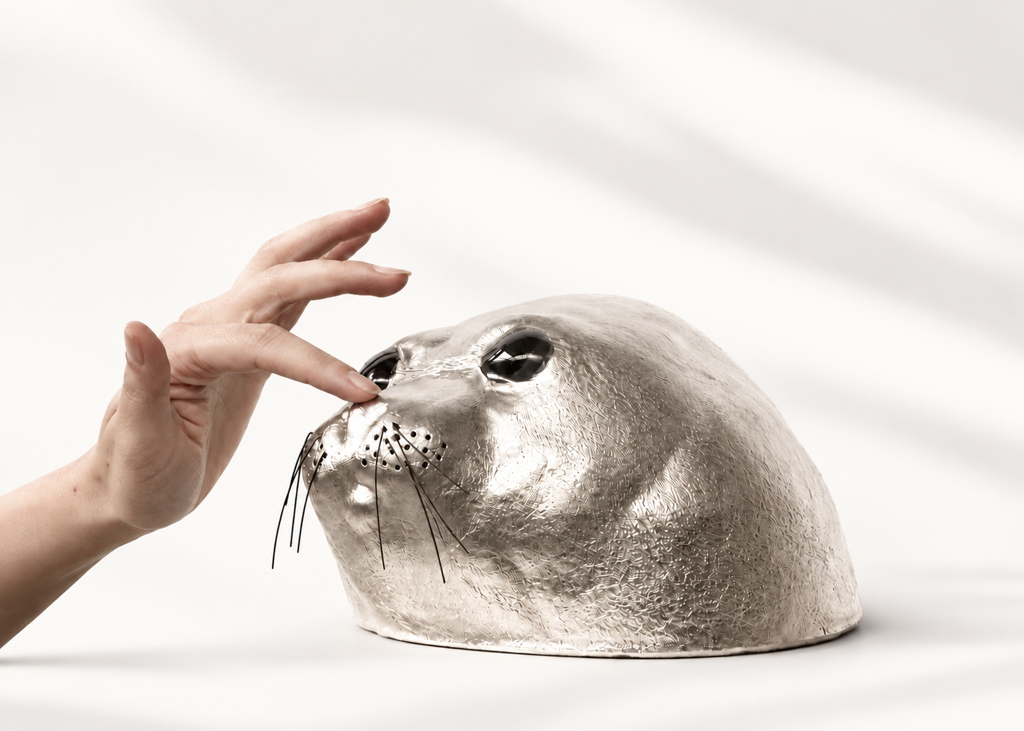 Silver ceramic seal sculpture
