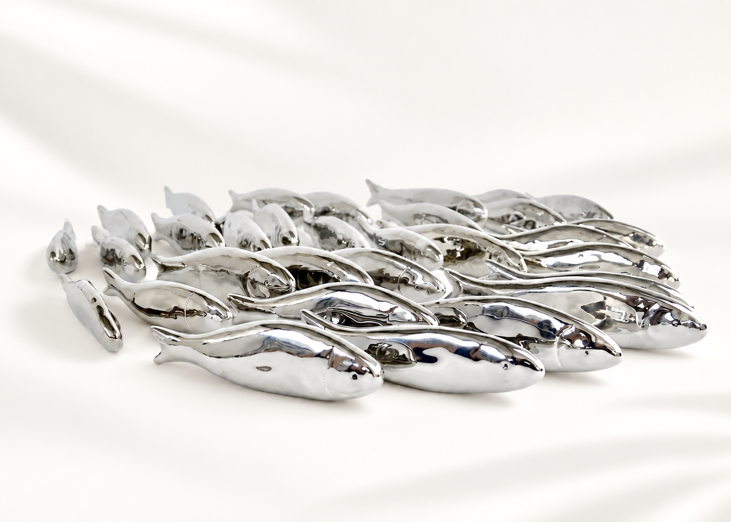 Silver ceramic fish collection